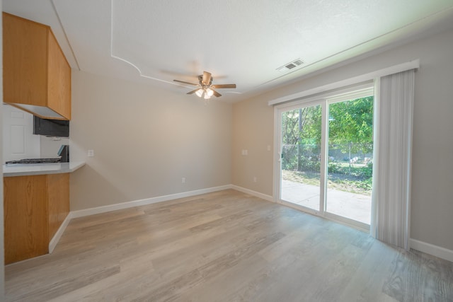 5867 Bell Rd, Redding, CA 96001 - unfurnished living room with a ceiling fan, baseboards, and light wood-style flooring