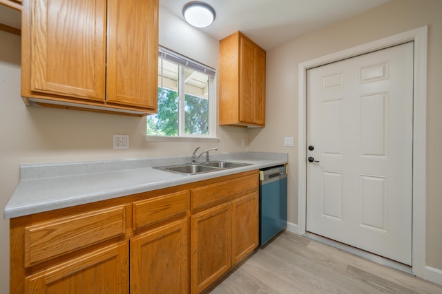 5867 Bell Rd, Redding, CA 96001 - kitchen featuring dishwasher, a sink, light wood-style flooring, and light countertops