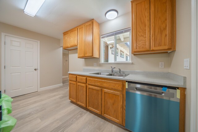 5867 Bell Rd, Redding, CA 96001 - kitchen with dishwasher, a sink, light countertops, and light wood-style flooring