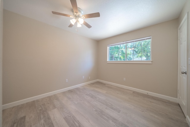 5867 Bell Rd, Redding, CA 96001 - spare room featuring ceiling fan, light wood-type flooring, and baseboards