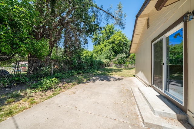 5867 Bell Rd, Redding, CA 96001 - fenced backyard with a patio area