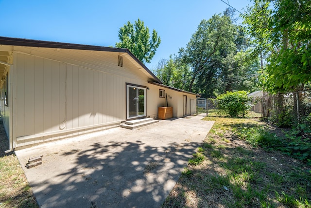 5867 Bell Rd, Redding, CA 96001 - rear view of house featuring a patio, entry steps, and driveway