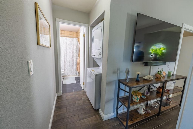 410 Ridgecrest Trl Unit 226, Redding, CA 96003 - corridor with stacked washer / dryer, baseboards, dark wood finished floors, and a textured wall