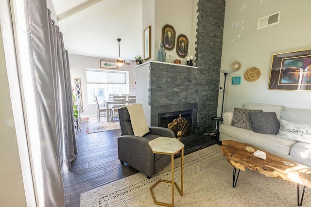 410 Ridgecrest Trl Unit 226, Redding, CA 96003 - living area featuring wood finished floors, a stone fireplace, a ceiling fan, and high vaulted ceiling
