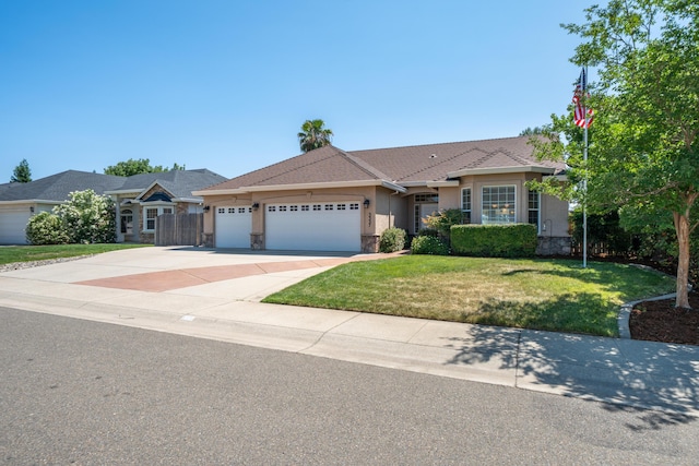 3337 Old Lantern Dr, Redding, CA 96003 - ranch-style house featuring stone siding, an attached garage, driveway, and a front yard
