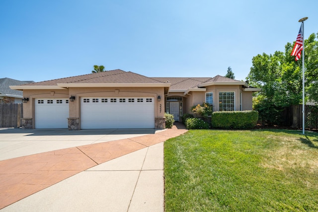 3337 Old Lantern Dr, Redding, CA 96003 - single story home featuring stucco siding, an attached garage, driveway, and stone siding