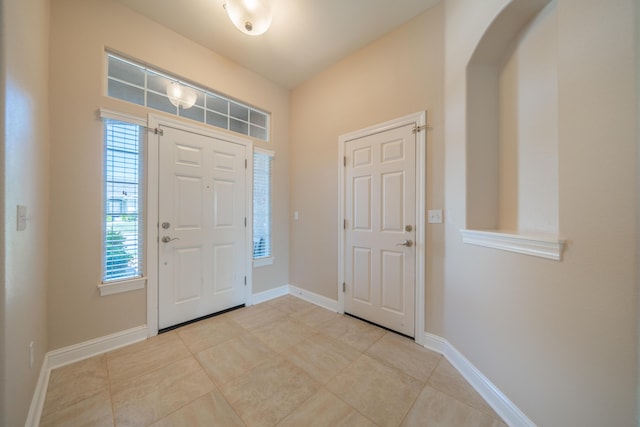 3337 Old Lantern Dr, Redding, CA 96003 - foyer with arched walkways, baseboards, and tile patterned floors