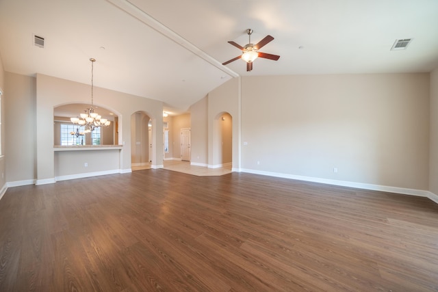 3337 Old Lantern Dr, Redding, CA 96003 - unfurnished living room with a chandelier, ceiling fan, arched walkways, lofted ceiling, and dark wood-type flooring
