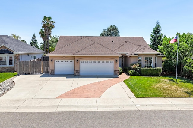 3337 Old Lantern Dr, Redding, CA 96003 - view of front of house featuring stucco siding, stone siding, driveway, and a garage