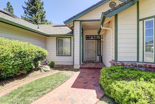 3097 Butterfly Ln, Shasta Lake, CA 96019 - doorway to property with roof with shingles and solar panels