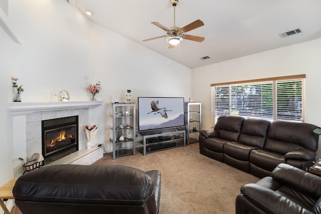 3097 Butterfly Ln, Shasta Lake, CA 96019 - living room featuring lofted ceiling, carpet floors, a ceiling fan, and a tiled fireplace