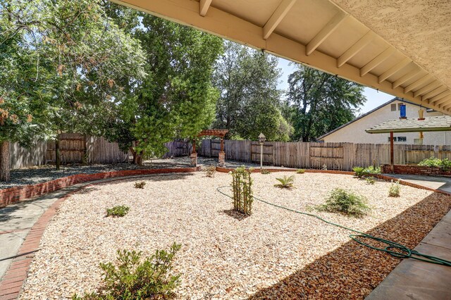 3097 Butterfly Ln, Shasta Lake, CA 96019 - fenced backyard with a patio