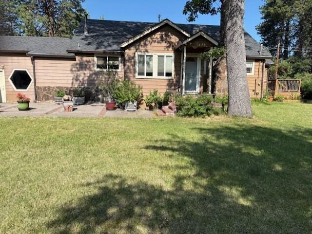 20344 Hudson St, Burney, CA 96013 - back of house with a lawn and a patio
