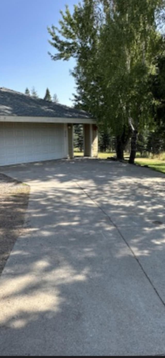 7914 Airport Way, Shingletown, CA 96088 - view of home's exterior featuring driveway and an attached garage