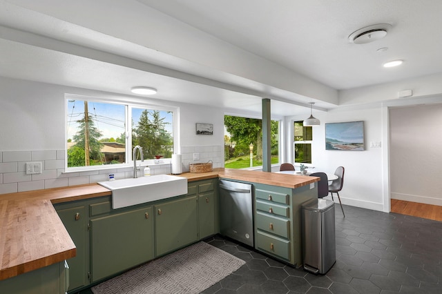 2180 Oak Ridge Dr, Redding, CA 96001 - kitchen featuring green cabinets, dishwasher, a peninsula, wood counters, and decorative backsplash
