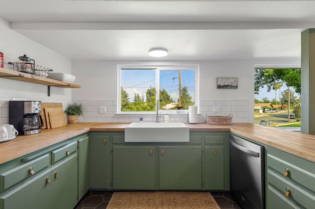 2180 Oak Ridge Dr, Redding, CA 96001 - kitchen featuring dishwasher, backsplash, dark tile patterned flooring, and butcher block counters