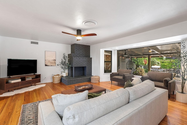 2180 Oak Ridge Dr, Redding, CA 96001 - living room featuring ceiling fan, a fireplace, and wood finished floors