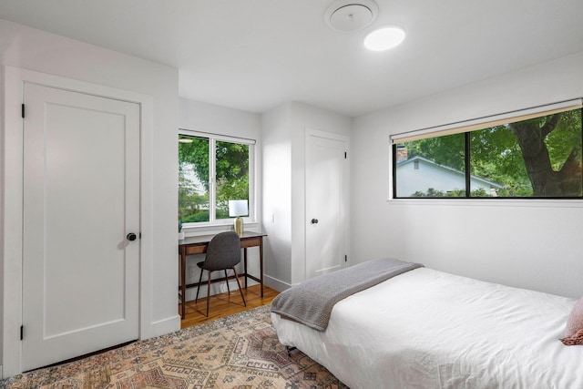 2180 Oak Ridge Dr, Redding, CA 96001 - bedroom featuring wood finished floors and a desk