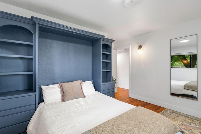 2180 Oak Ridge Dr, Redding, CA 96001 - bedroom with baseboards and wood finished floors