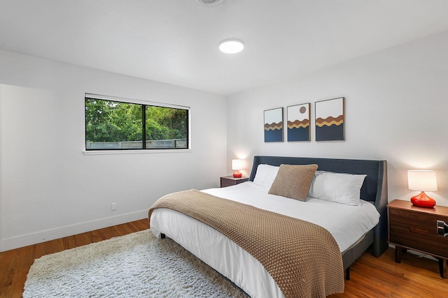 2180 Oak Ridge Dr, Redding, CA 96001 - bedroom featuring baseboards and wood finished floors