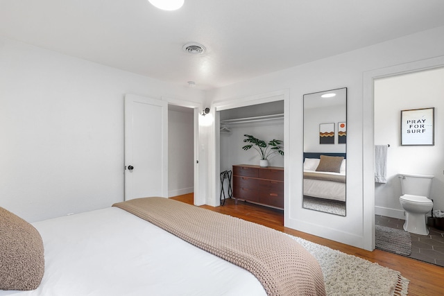 2180 Oak Ridge Dr, Redding, CA 96001 - bedroom with wood finished floors, a closet, and ensuite bath