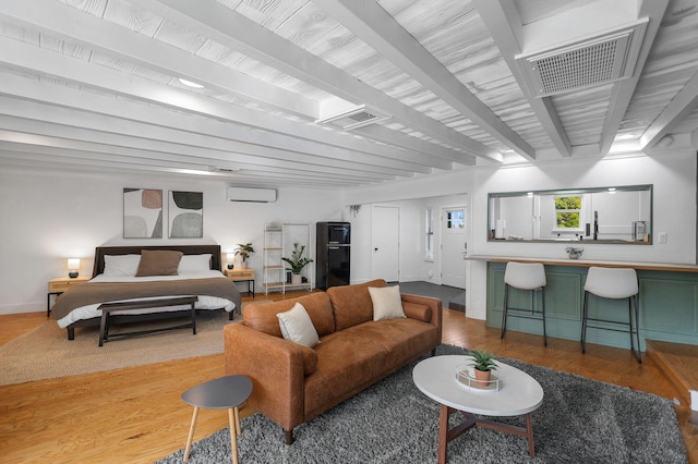 2180 Oak Ridge Dr, Redding, CA 96001 - living room featuring an AC wall unit, beam ceiling, and wood finished floors