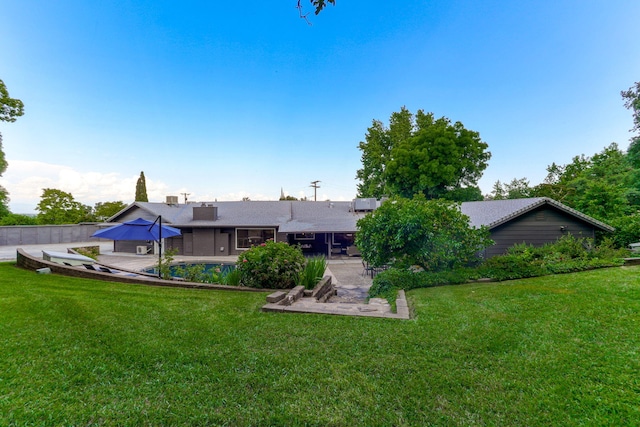 2180 Oak Ridge Dr, Redding, CA 96001 - back of property with a patio area, a yard, and a swimming pool