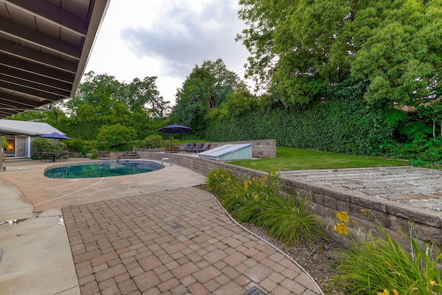 2180 Oak Ridge Dr, Redding, CA 96001 - view of pool featuring a patio, a yard, and view of wooded area