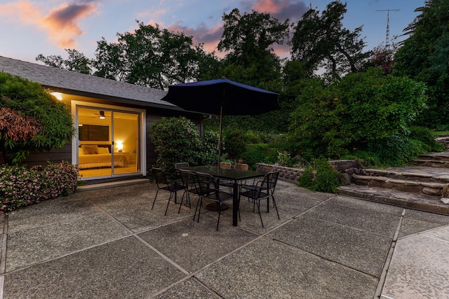 2180 Oak Ridge Dr, Redding, CA 96001 - patio terrace at dusk featuring a patio and outdoor dining area