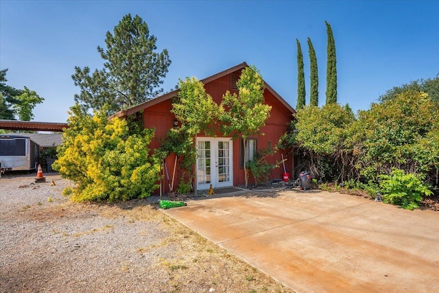 2025 El Verano St, Redding, CA 96002 - view of property hidden behind natural elements featuring french doors