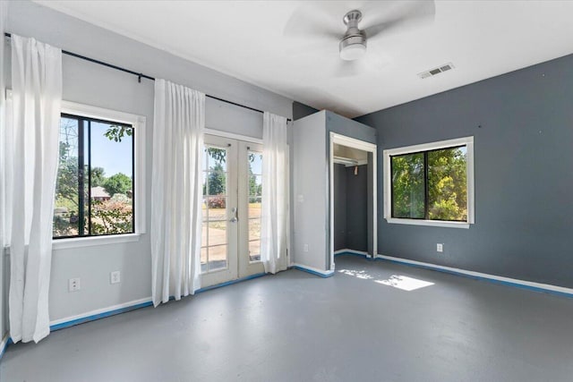 2025 El Verano St, Redding, CA 96002 - unfurnished bedroom featuring french doors, access to exterior, finished concrete flooring, baseboards, and a ceiling fan