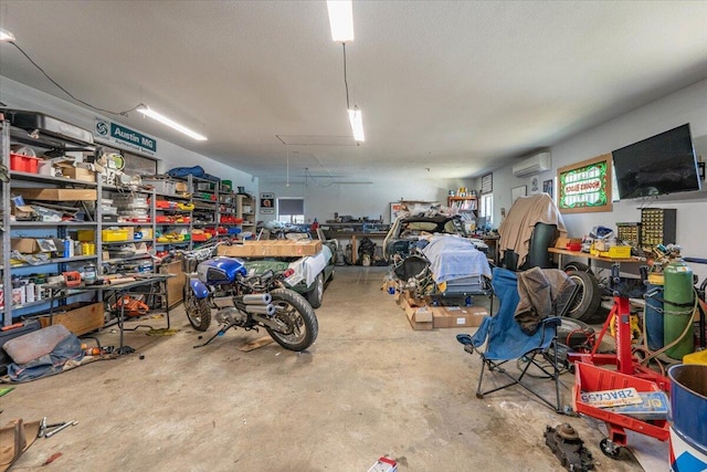 2025 El Verano St, Redding, CA 96002 - garage featuring a wall mounted air conditioner and a workshop area
