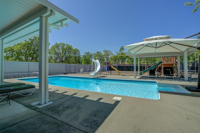 17400 Pittim Dr, Redding, CA 96003 - view of pool with a water slide, a fenced backyard, and a patio area