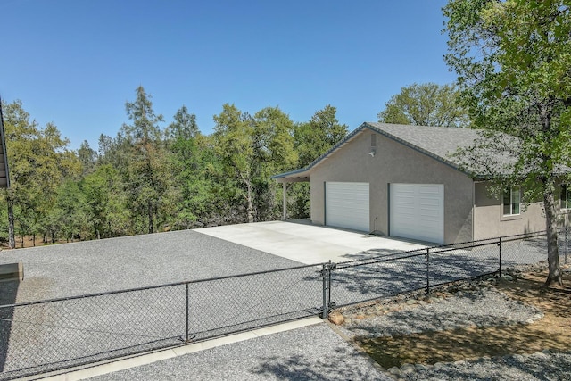 17400 Pittim Dr, Redding, CA 96003 - garage featuring a gate and concrete driveway