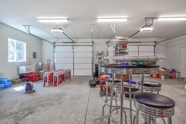 17400 Pittim Dr, Redding, CA 96003 - garage featuring electric panel and a garage door opener