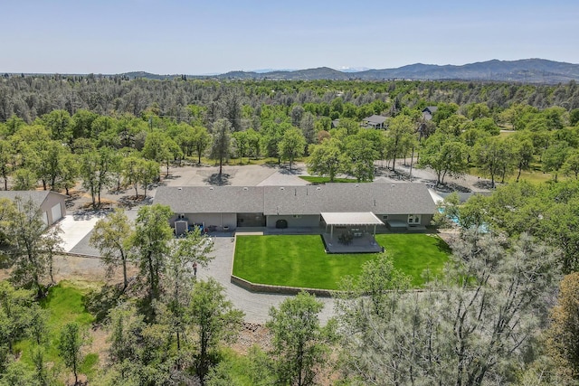 17400 Pittim Dr, Redding, CA 96003 - view of subject property with a heavily wooded area and a mountain backdrop