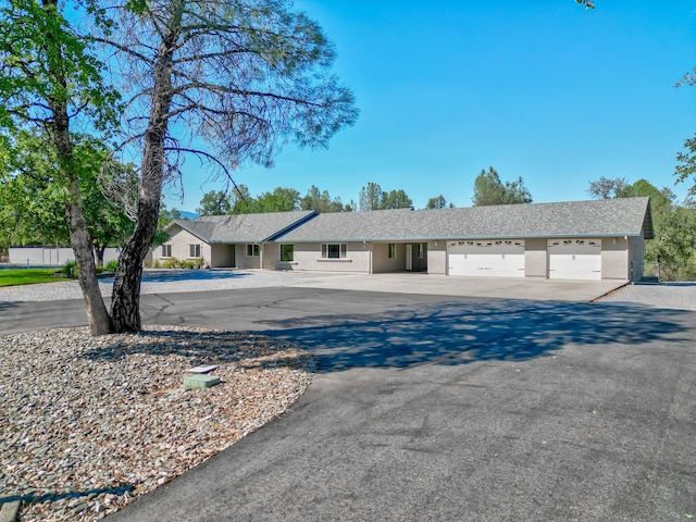 17400 Pittim Dr, Redding, CA 96003 - ranch-style house with driveway, stucco siding, and an attached garage