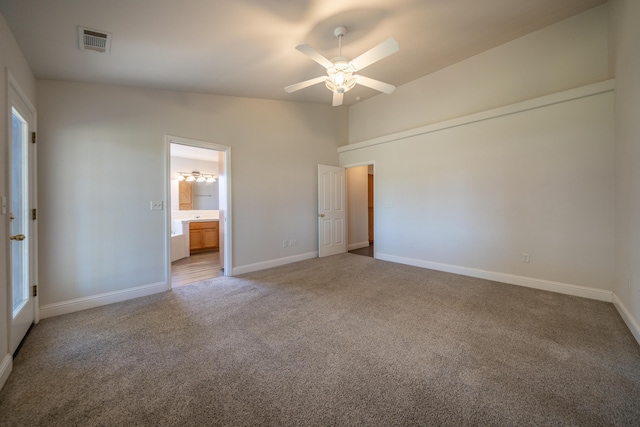 3255 Wandsworth Dr, Shasta Lake, CA 96019 - unfurnished bedroom with carpet floors, vaulted ceiling, ensuite bath, and a ceiling fan