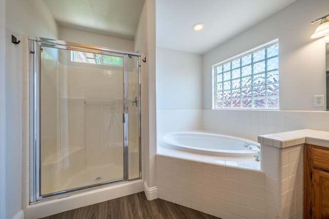 3255 Wandsworth Dr, Shasta Lake, CA 96019 - full bath featuring a bath, a shower stall, wood finished floors, plenty of natural light, and recessed lighting