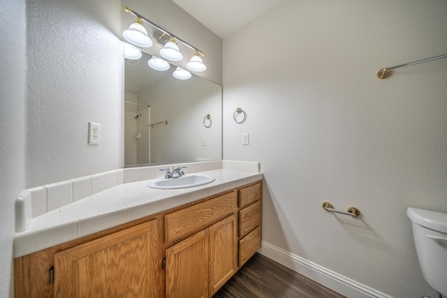 3255 Wandsworth Dr, Shasta Lake, CA 96019 - bathroom featuring vanity, wood finished floors, and a shower