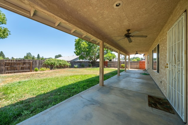 3255 Wandsworth Dr, Shasta Lake, CA 96019 - fenced backyard with ceiling fan and a patio