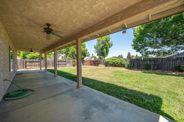 3255 Wandsworth Dr, Shasta Lake, CA 96019 - fenced backyard with a patio and a ceiling fan