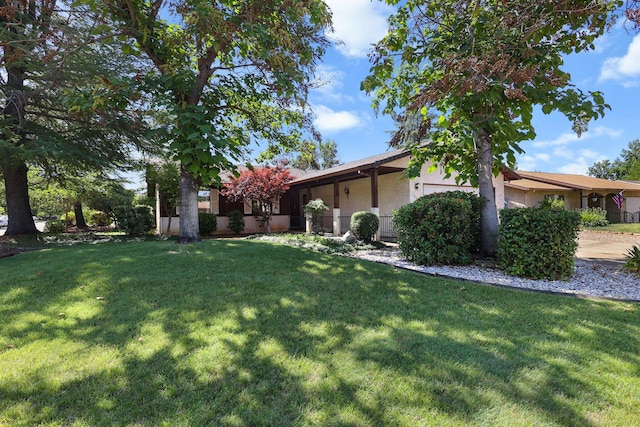 1401 Casa Vereda Way, Redding, CA 96003 - view of grassy yard featuring an attached garage
