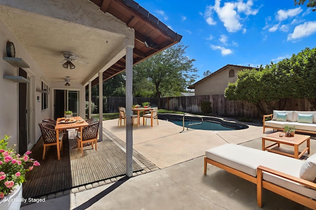 1401 Casa Vereda Way, Redding, CA 96003 - fenced backyard with outdoor dining space, an outdoor hangout area, a ceiling fan, and a patio area