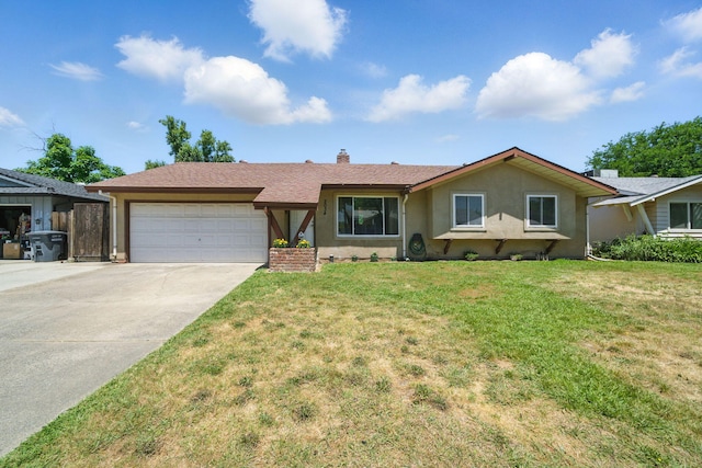 2034 Wilder Dr, Redding, CA 96002 - ranch-style home with a garage, driveway, stucco siding, and a front lawn