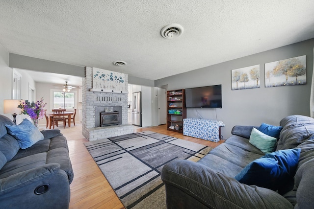 2034 Wilder Dr, Redding, CA 96002 - living area with light wood finished floors and a textured ceiling