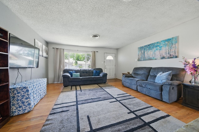 2034 Wilder Dr, Redding, CA 96002 - living room featuring wood finished floors and a textured ceiling