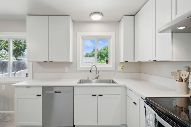 2034 Wilder Dr, Redding, CA 96002 - kitchen featuring dishwasher, a sink, range hood, and plenty of natural light