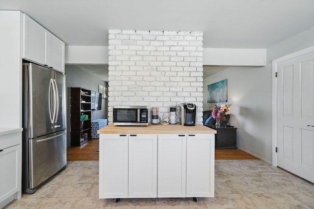 2034 Wilder Dr, Redding, CA 96002 - kitchen with stainless steel appliances, wood counters, and white cabinets