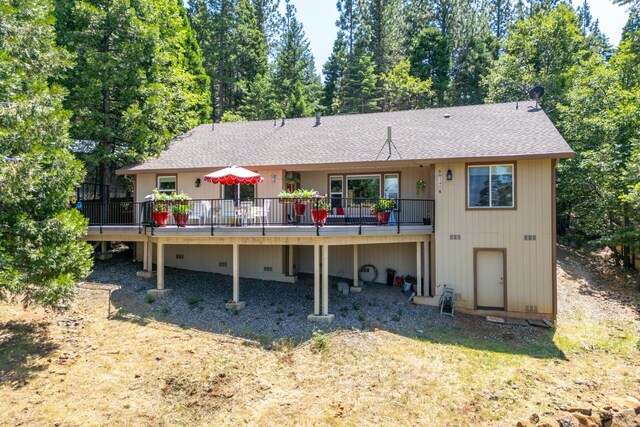 7256 Shasta Forest Dr, Shingletown, CA 96088 - back of property featuring a shingled roof and a wooden deck